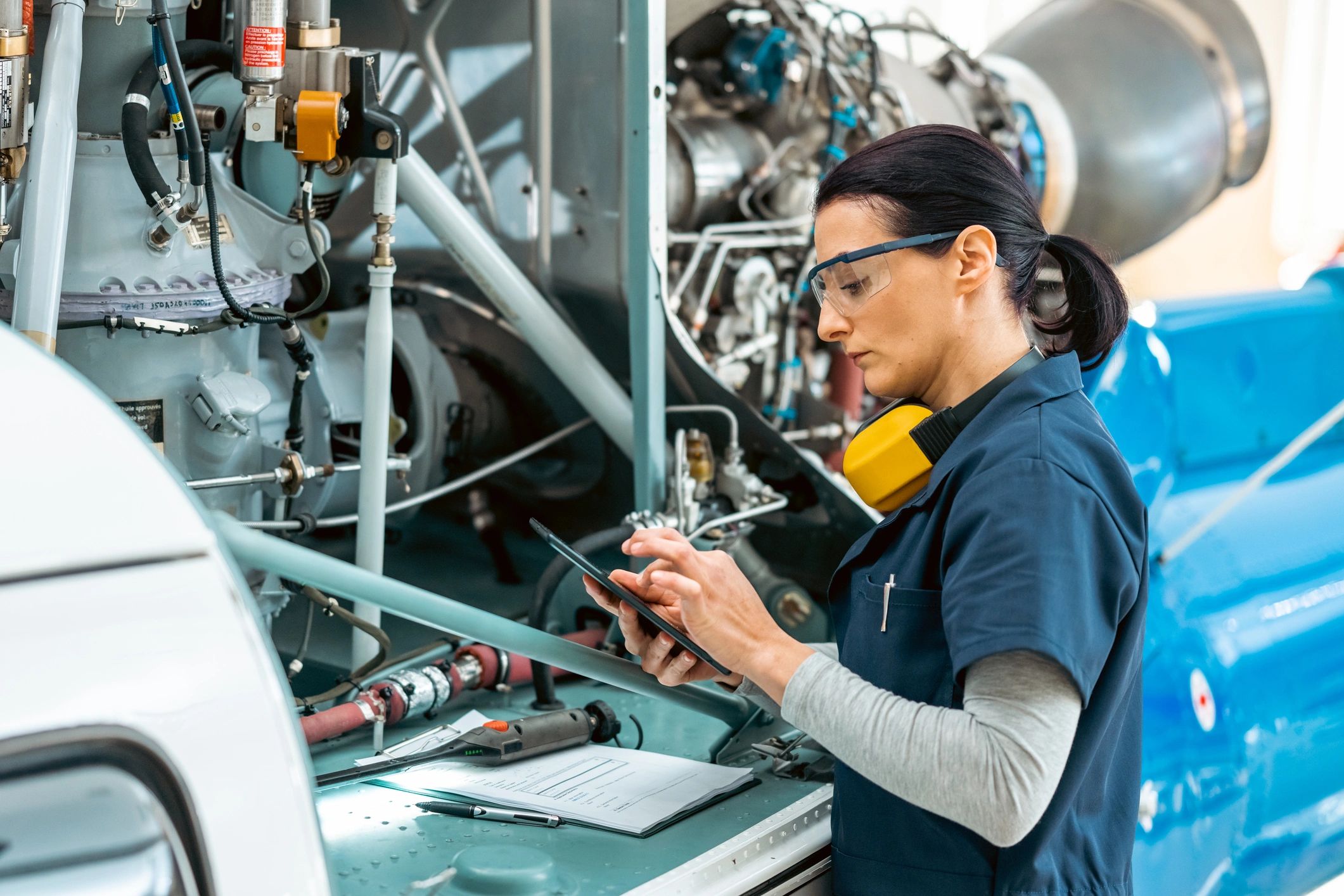 Technician reviewing maintenance checklist on site